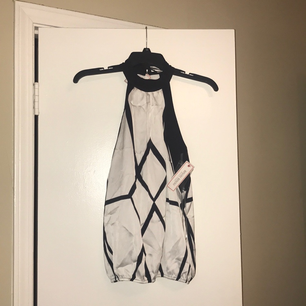 Sleeveless black and white blouse